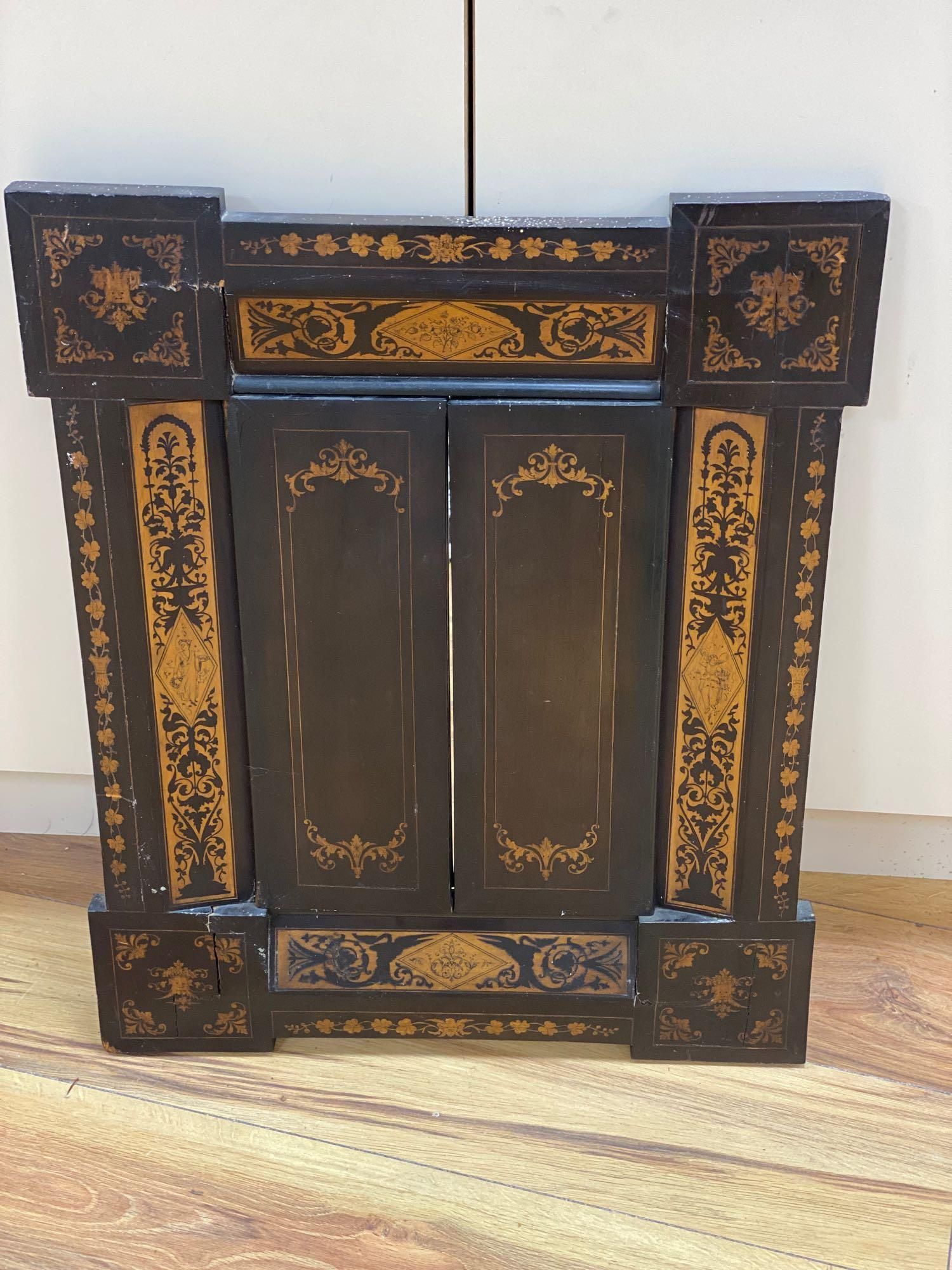 A 19th century Sorrento marquetry framed wall mirror, enclosed by two doors, 61.5 x 50cm